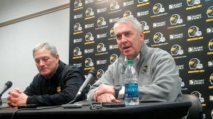 Iowa head coach Kirk Ferentz (left) and athletics director Gary Barta discuss the Hawkeyes' invitation to the 2014 Outback Bowl against No. 14 LSU during a press conference held Sunday, Dec. 8, 2013, at the Hayden Fry Football Complex in Iowa City. This will be Iowa's fourth Outback Bowl appearance under Ferentz. The game takes place at Raymond James Stadium in Tampa, Fla., on Wednesday, Jan. 1, 2014.