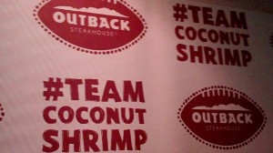 The backdrop near the entrance to the Coralville Outback Steakhouse during Iowa's team lunch there on Monday, Dec. 23, 2013. Should Iowa defeat No. 14 LSU in the 2014 Outback Bowl, the restaurant will supply complimentary Coconut Shrimps to all its customers on the date of Jan. 2, 2014.