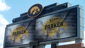 The video board behind the South end zone of Kinnick Stadium pays tribute to former Iowa defensive coordinator Norm Parker during his "Celebration of Life" ceremony on Saturday, May 31, 2014. Parker died last January from complications with Diabetes.